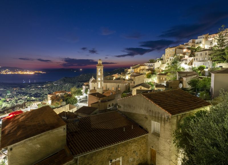 The village of Lumio at night